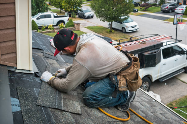 Professional Roofing technician working in Mill City, OR